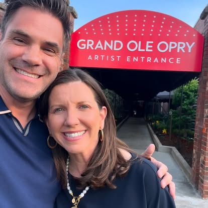 Two people outside the Grand Ole Opry artist entrance
